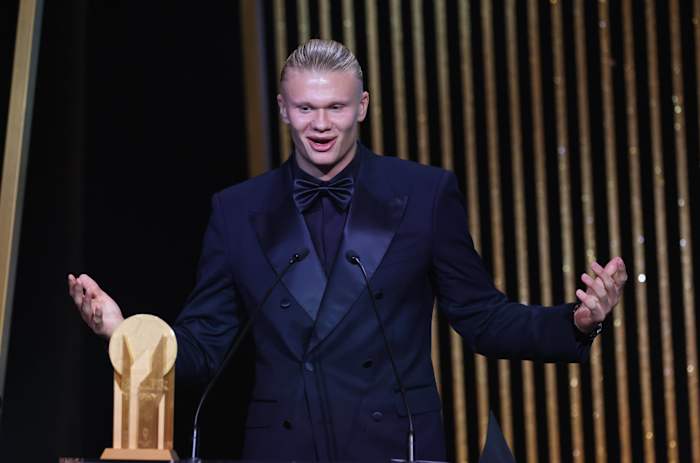 Erling Haaland pictured speaking on stage at the 2023 Ballon d'Or awards ceremony, where he was beaten to the main prize by Lionel Messi but received the Gerd Muller Trophy for being the Striker of the Year